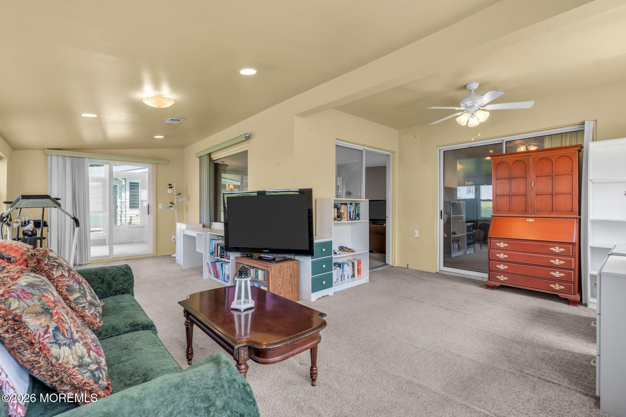 67 Blake Circle Brick, NJ 08724 - Photo 30 of 34 a living room with furniture and a flat screen tv