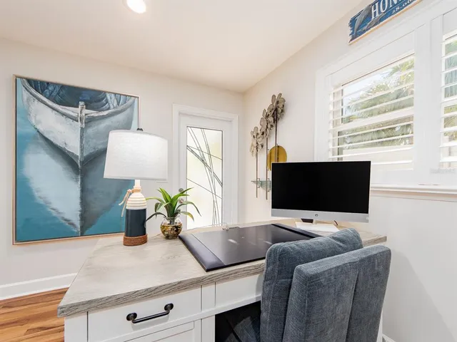 a kitchen with stainless steel appliances granite countertop a refrigerator a sink and a stove