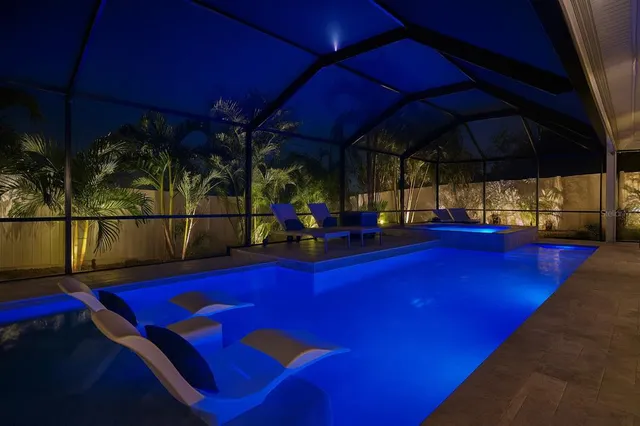 a bathroom with a shower sink and mirror