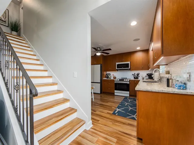 a bathroom with a sink toilet mirror and tub