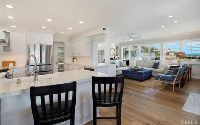 a large kitchen with a table and chairs