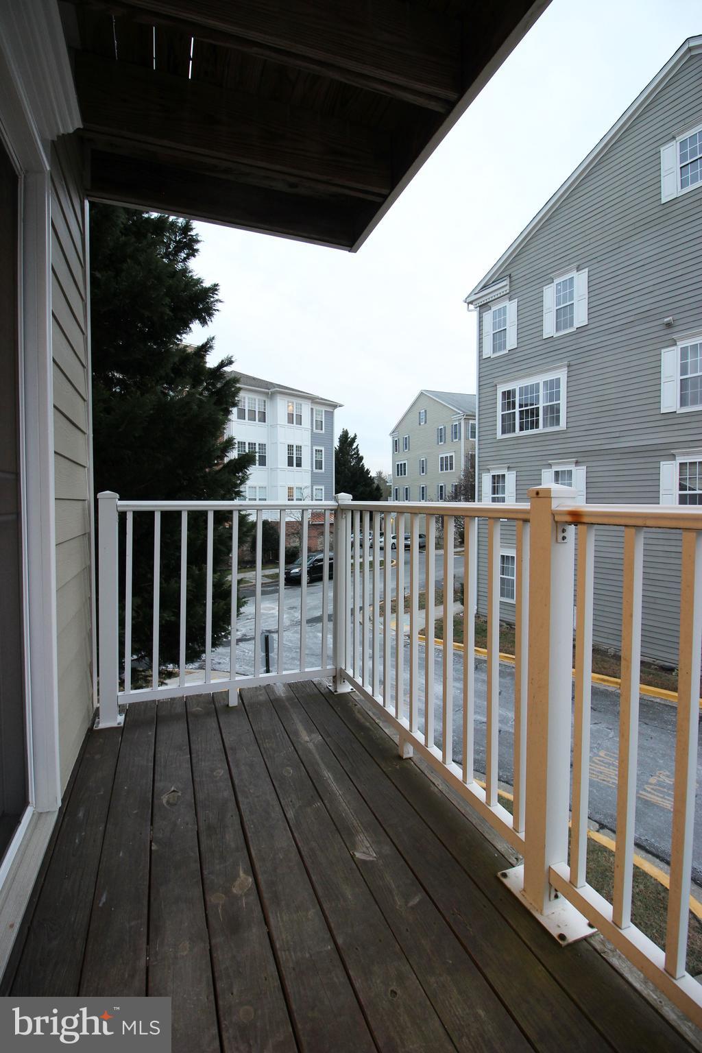 141 Chevy Chase Street, Unit 141 Gaithersburg, MD 20878 - Photo 13 of 32 a view of a balcony with wooden floor