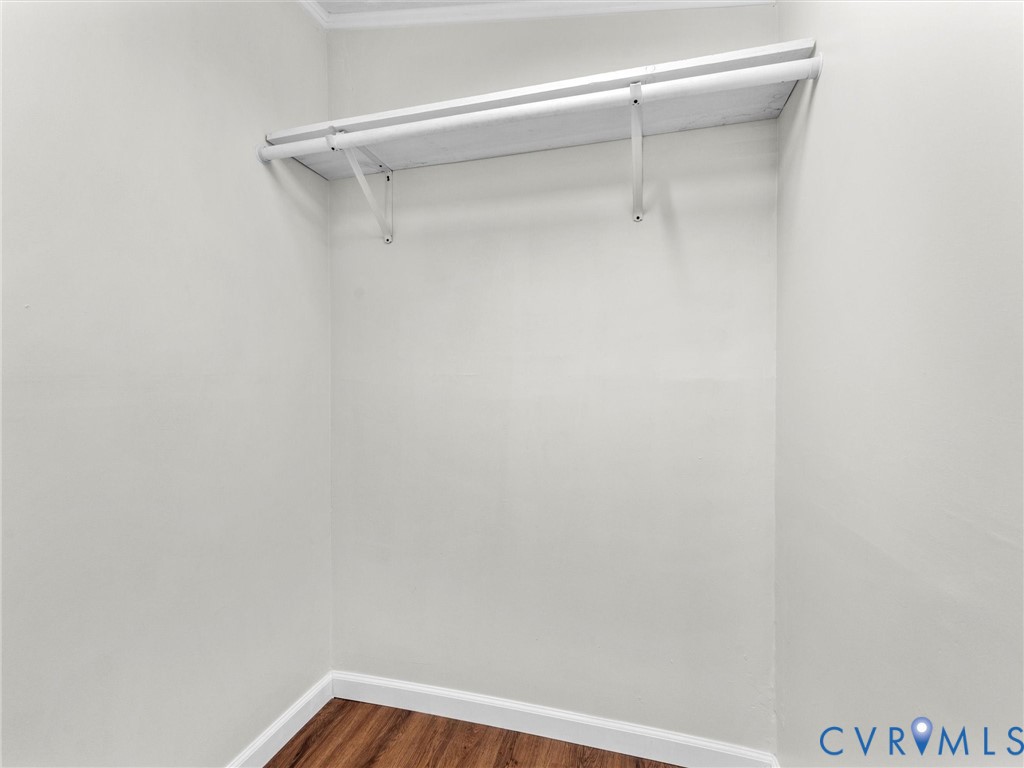 4772 Carsley Road Waverly, VA 23890 - Photo 24 of 38 Spacious closet featuring dark wood-style flooring