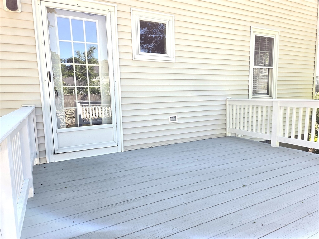 25 Waldeck Road Milton, MA 02186 - Photo 30 of 34 a view of a deck with wooden floor and fence