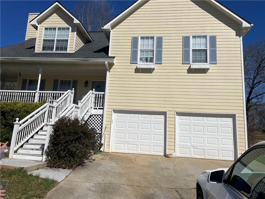 a front view of a house with garage