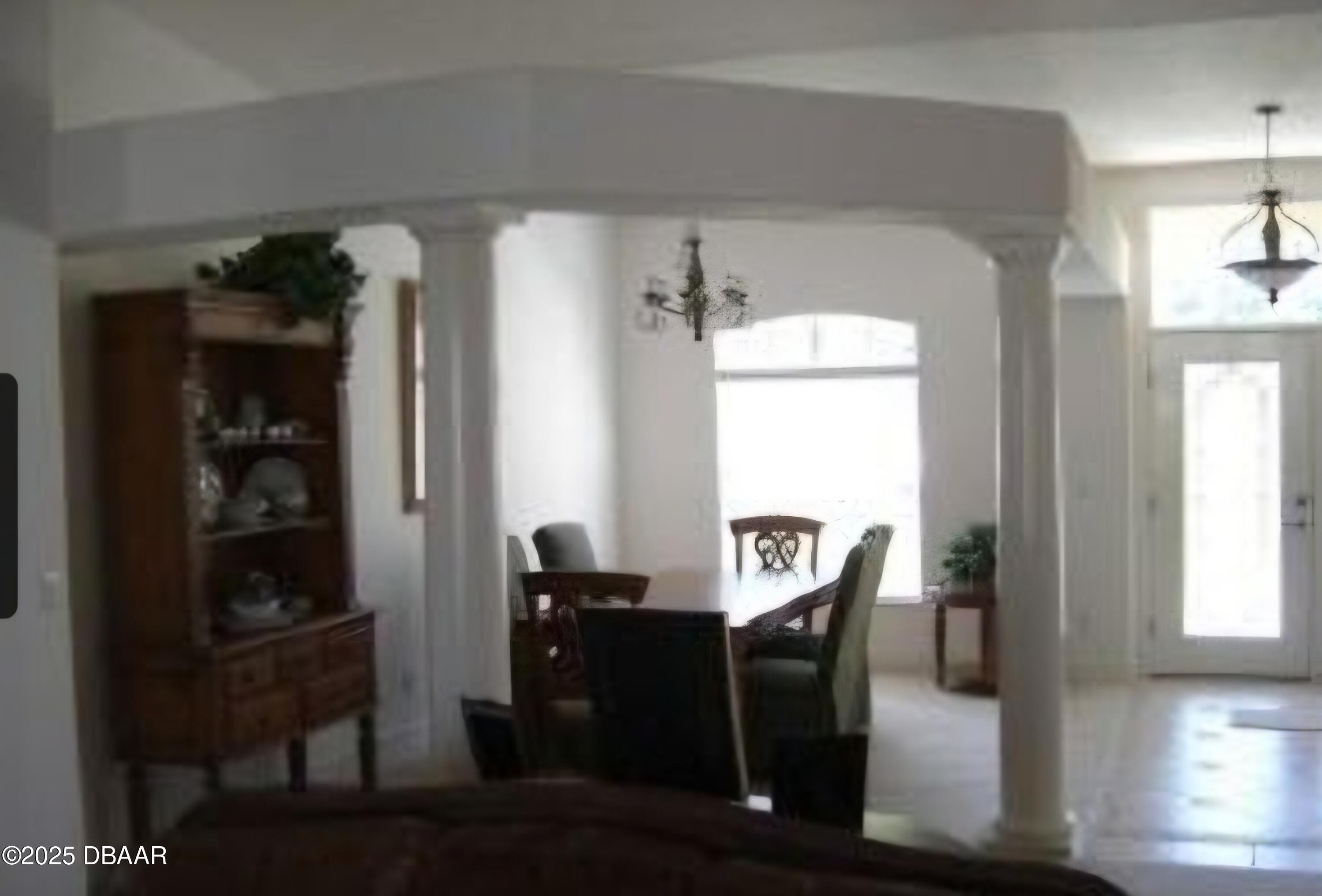 4 Waterbluff Drive Ormond Beach, FL 32174 - Photo 3 of 7 a view of a dining room with furniture and window