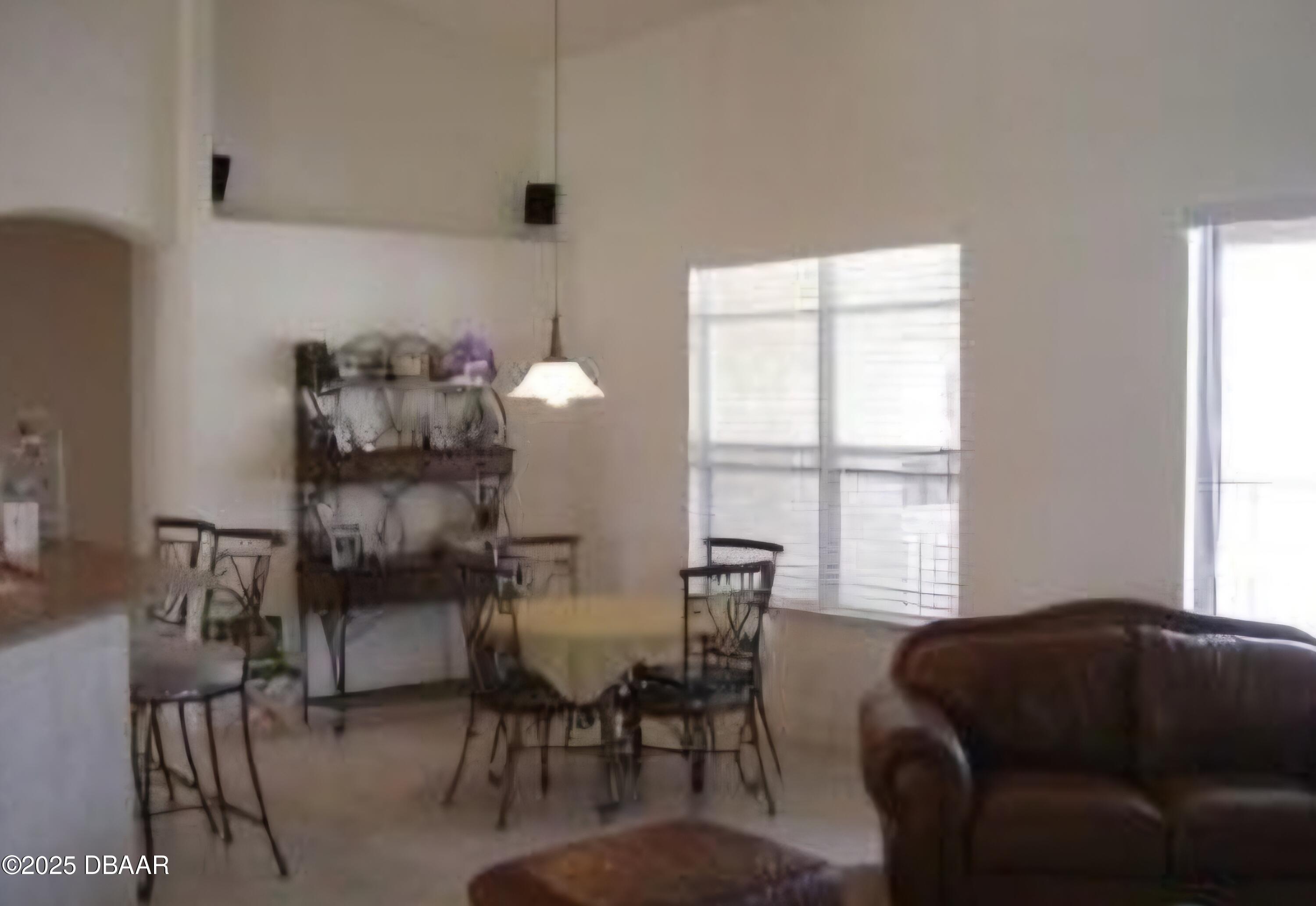 4 Waterbluff Drive Ormond Beach, FL 32174 - Photo 6 of 7 a living room with furniture and a large window