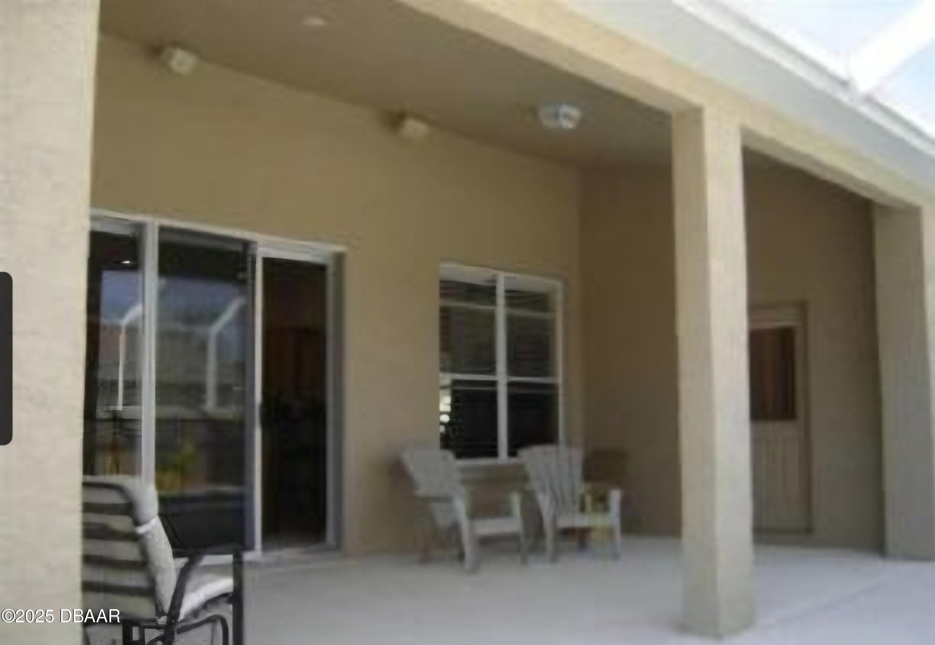 4 Waterbluff Drive Ormond Beach, FL 32174 - Photo 7 of 7 a view of a room with chairs and front door