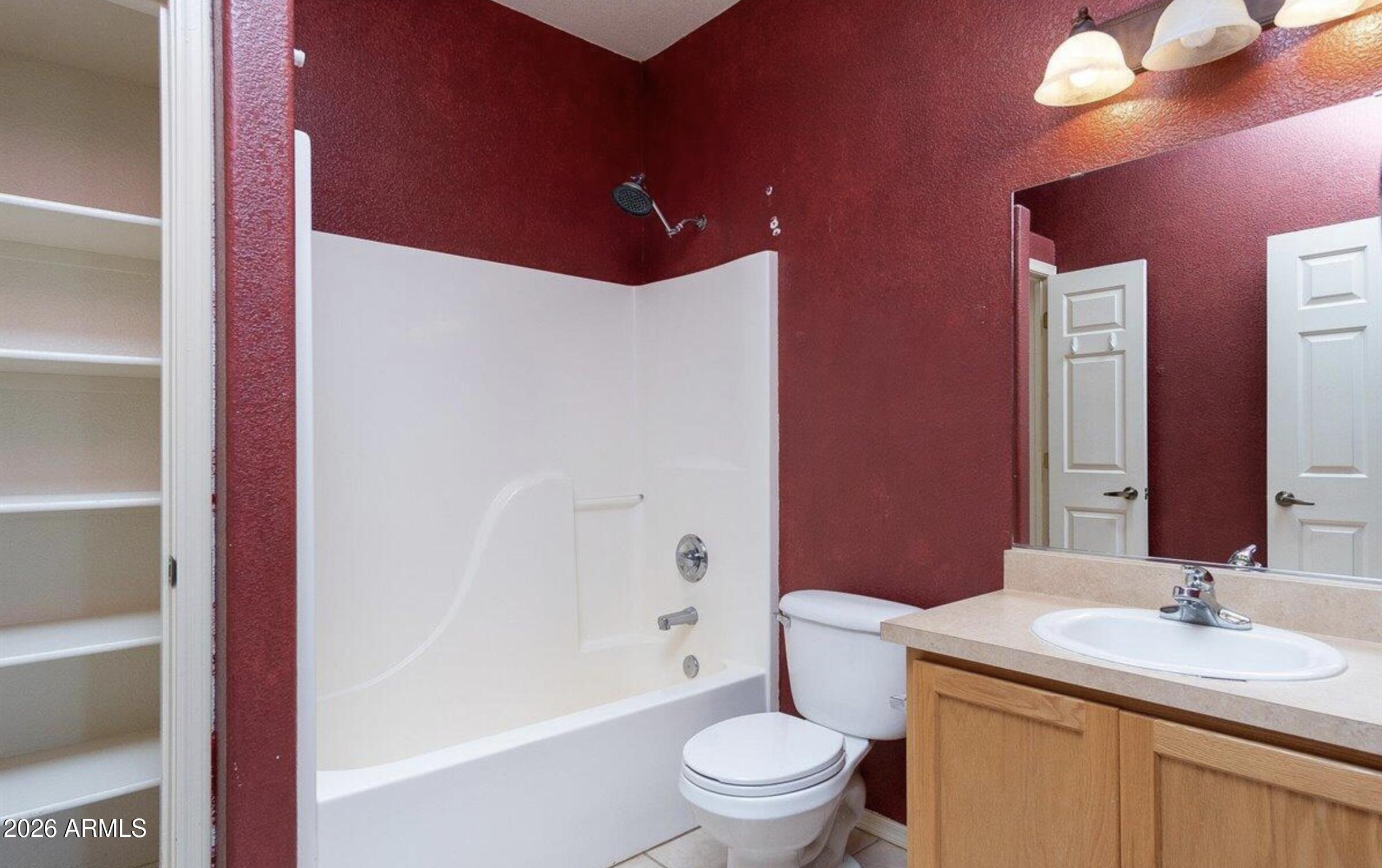 10193 East Windtalker Road Hereford, AZ 85615 - Photo 13 of 34 a bathroom with a granite countertop sink toilet and shower