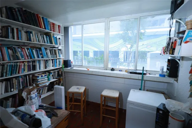 a room with furniture and a book shelf