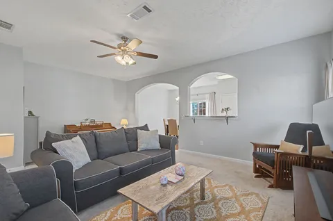 a room with furniture and a lamp