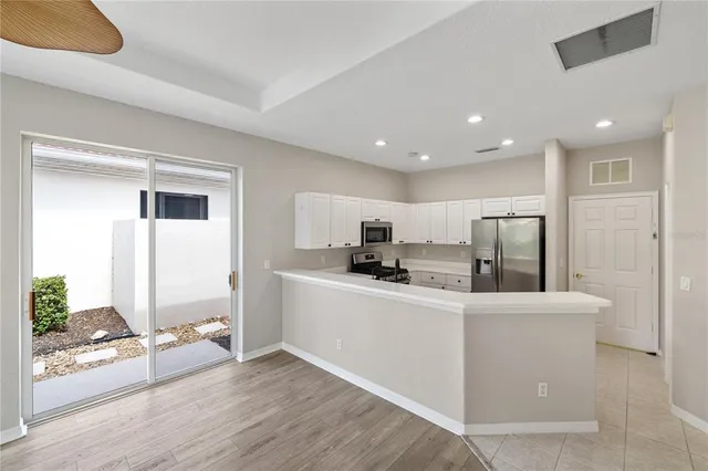 a view of a swimming pool with a yard