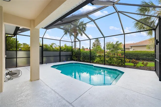 a kitchen with stainless steel appliances a stove sink microwave and cabinets