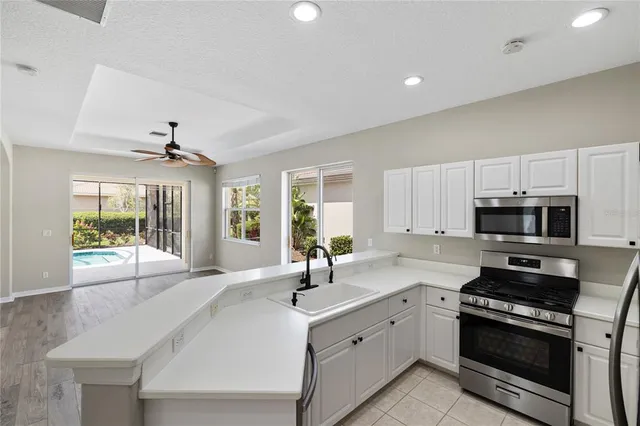 a bathroom with a sink toilet a mirror and shower