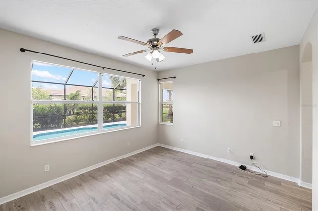 a bathroom with a sink shower and a mirror