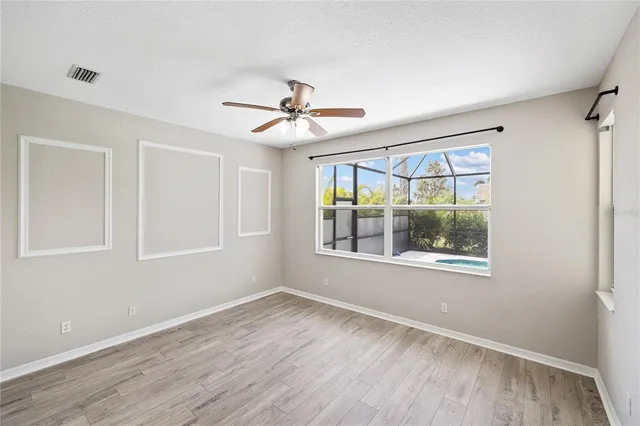 a view of washer and dryer with kitchen in the background