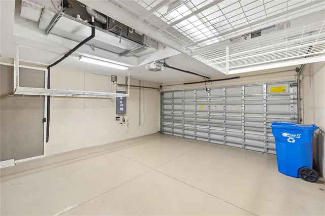 a view of a house with a yard and potted plants