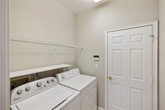 a dining room with furniture and view of a bathroom