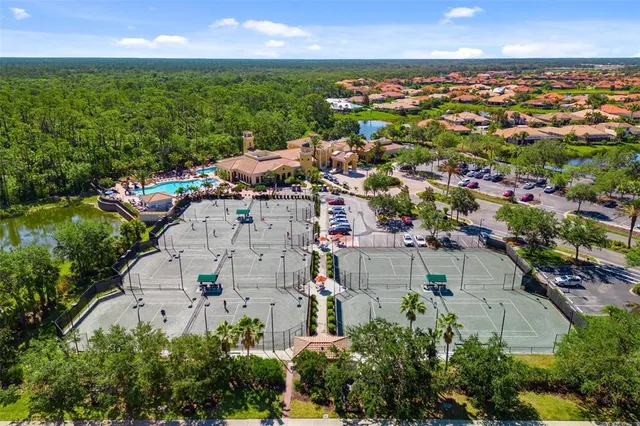 a front view of a house with a yard and flowers