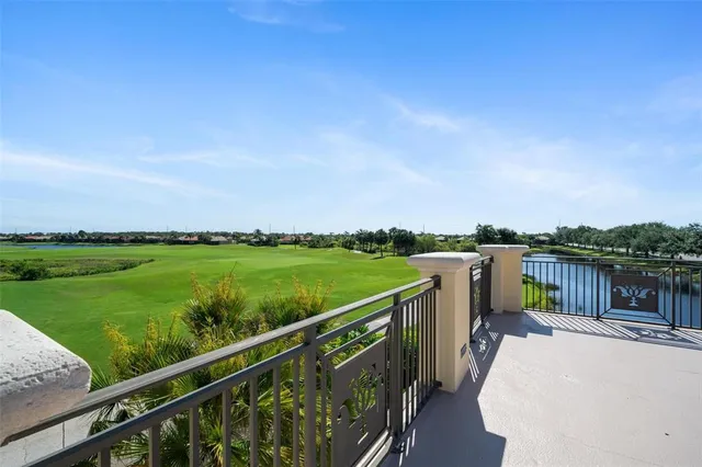 an aerial view of residential houses with outdoor space and swimming pool