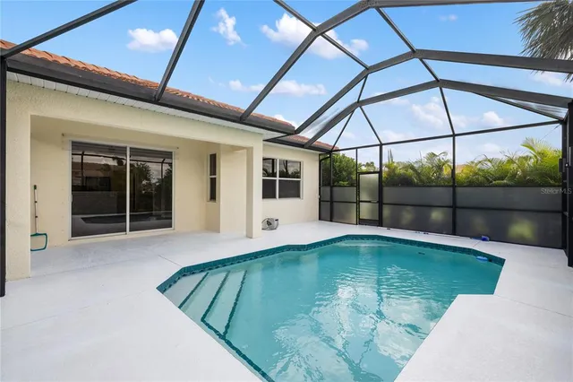 a view of a swimming pool with a yard