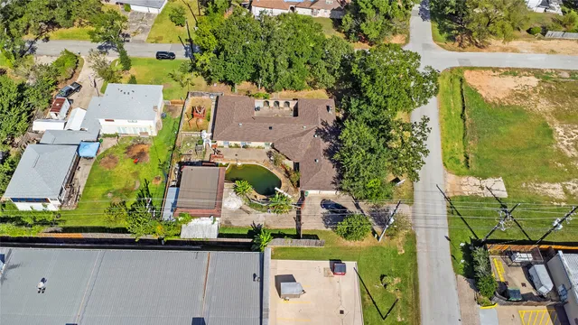 an aerial view of residential house with outdoor space and swimming pool