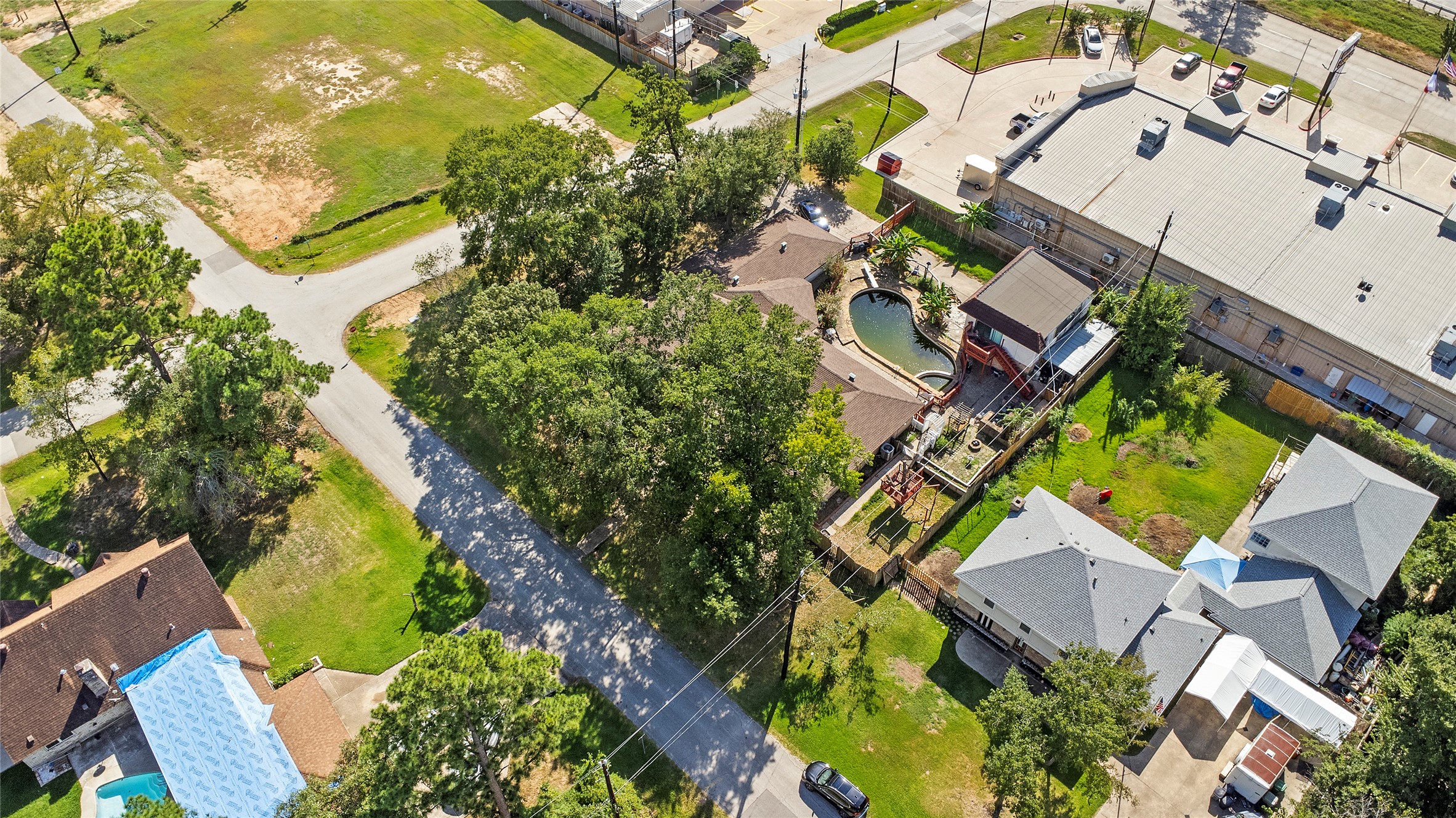 186 Spring Pines Drive Spring, TX 77386 - Photo 8 of 9 an aerial view of a house with a yard and greenery