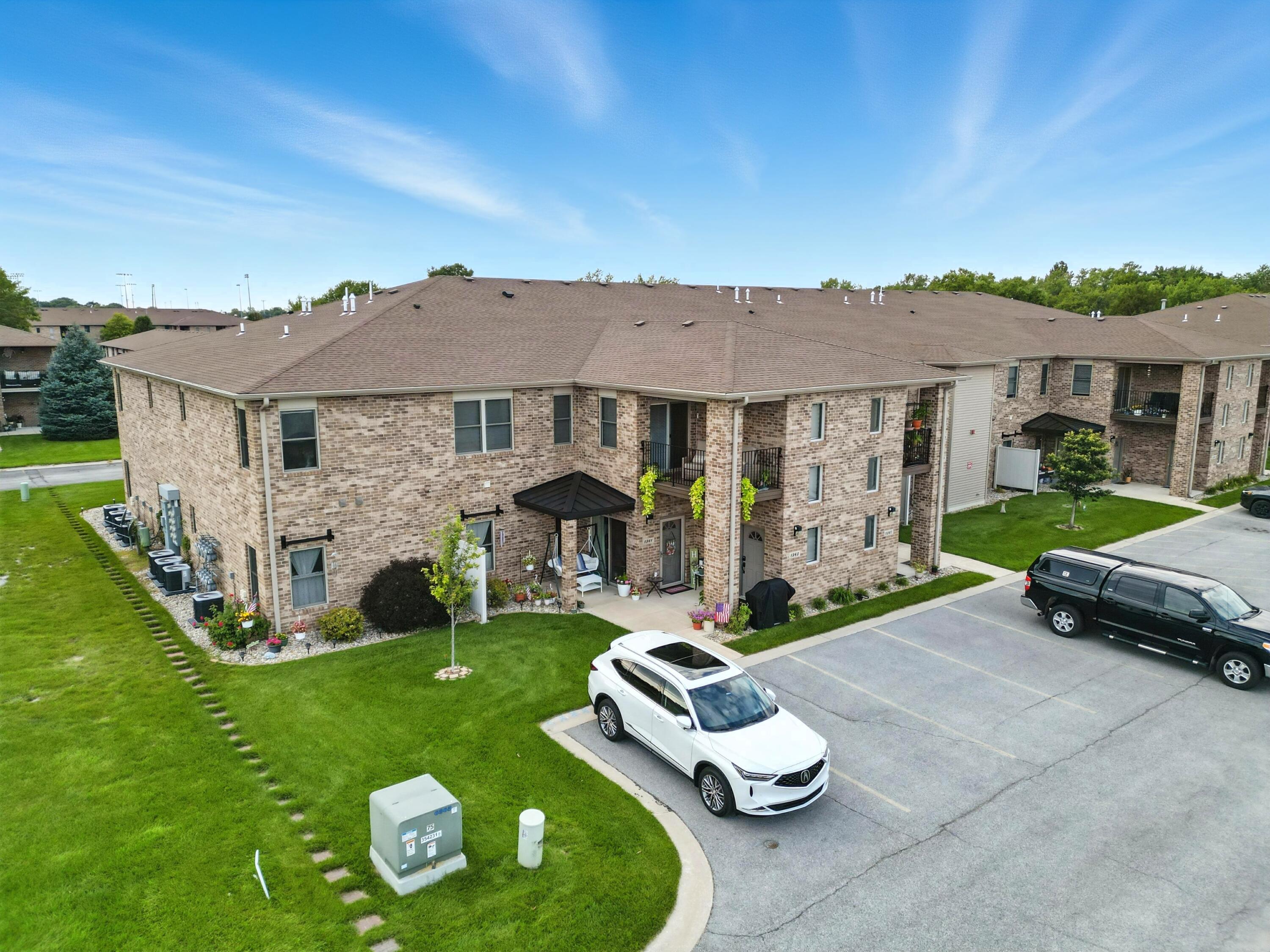 a front view of a house with a garden and porch