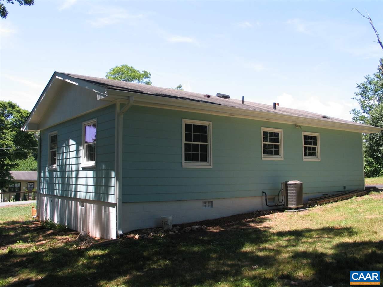 45 Holmes Run Road Stanardsville, VA 22973 - Photo 15 of 17 a backyard of a house with dishwasher and wooden fence