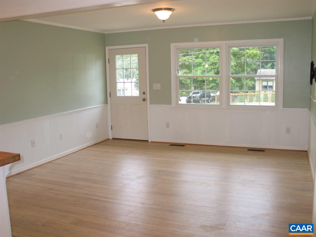 45 Holmes Run Road Stanardsville, VA 22973 - Photo 3 of 17 an empty room with wooden floor and windows