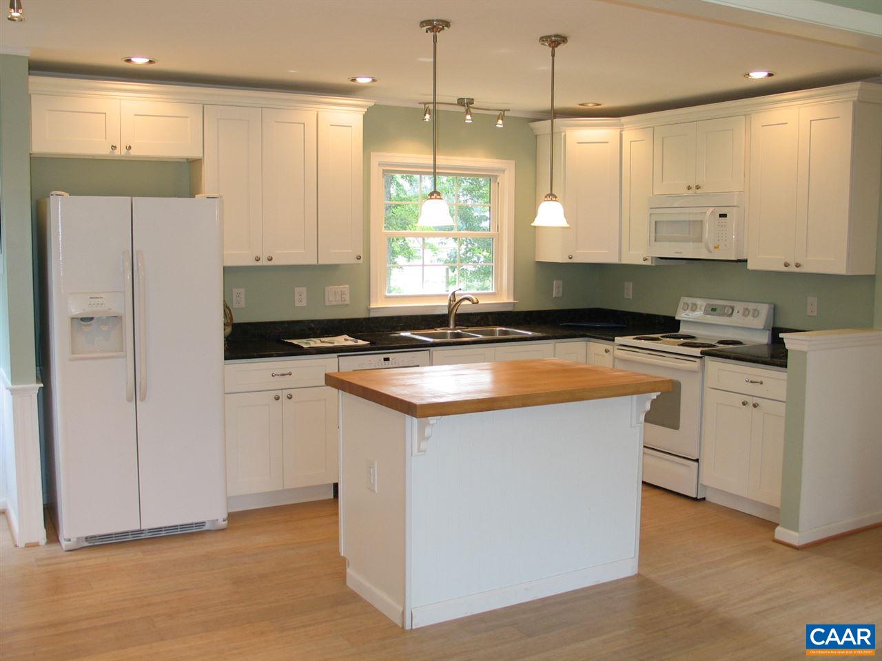 45 Holmes Run Road Stanardsville, VA 22973 - Photo 4 of 17 a kitchen that has a sink a window stainless steel appliances and cabinets