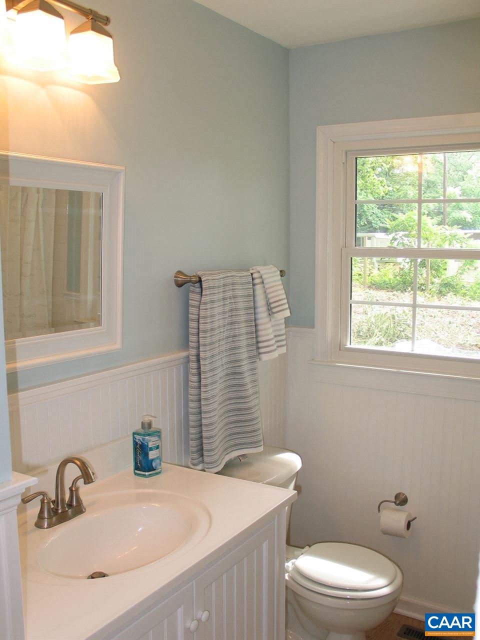 45 Holmes Run Road Stanardsville, VA 22973 - Photo 8 of 17 a bathroom with a sink a toilet and window