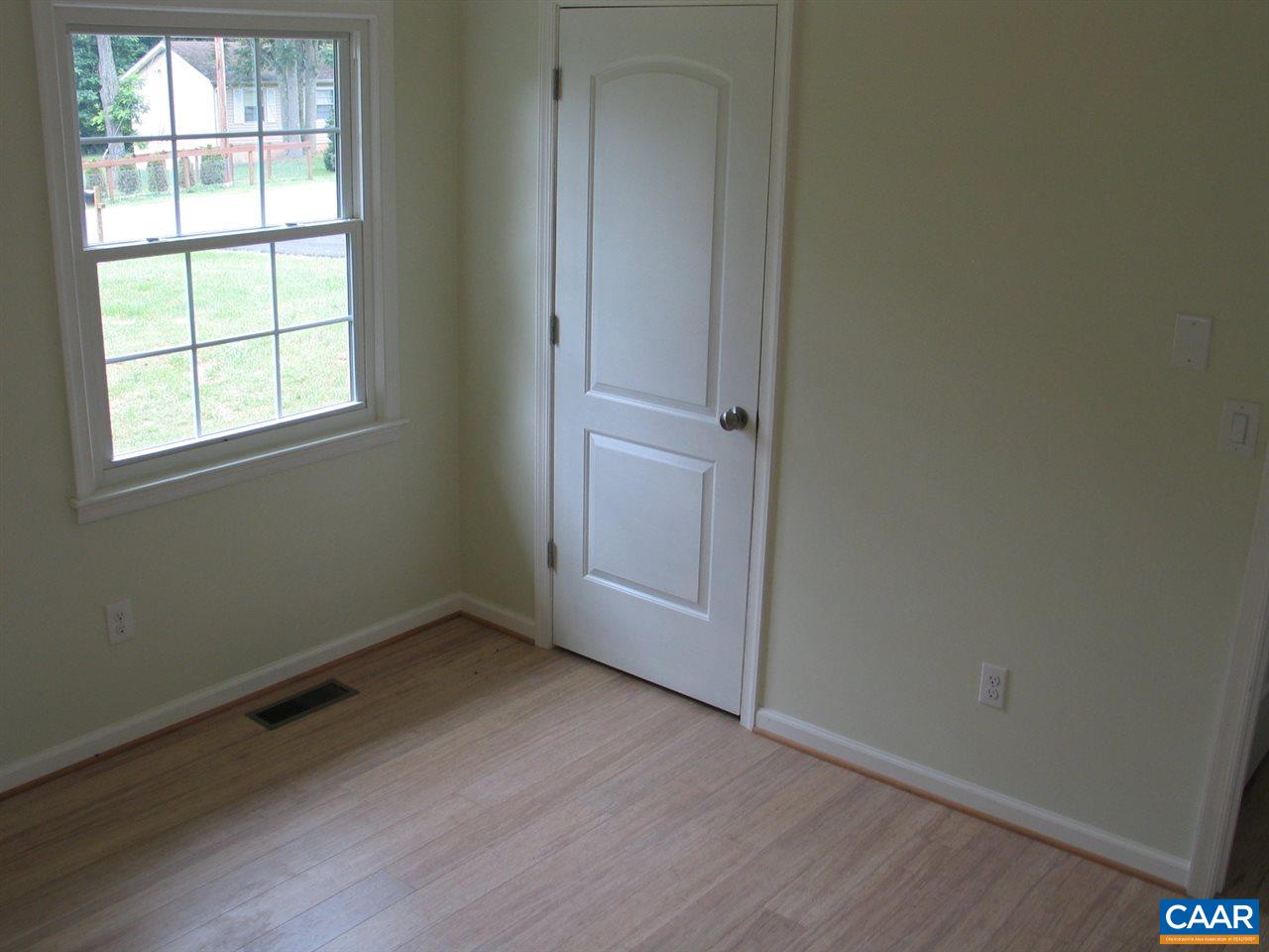 45 Holmes Run Road Stanardsville, VA 22973 - Photo 10 of 17 an empty room with wooden floor and windows
