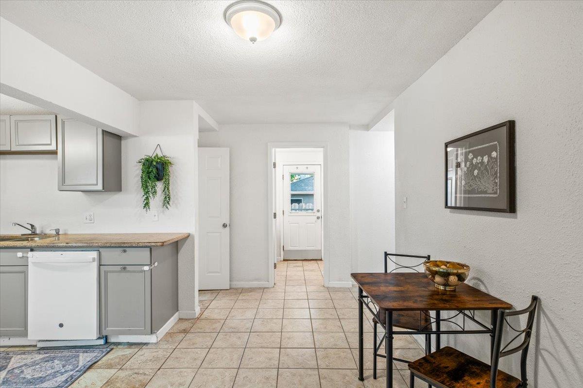 572 Pedersen Road Oakdale, CA 95361 - Photo 15 of 36 a view of a kitchen area with furniture and wooden floor