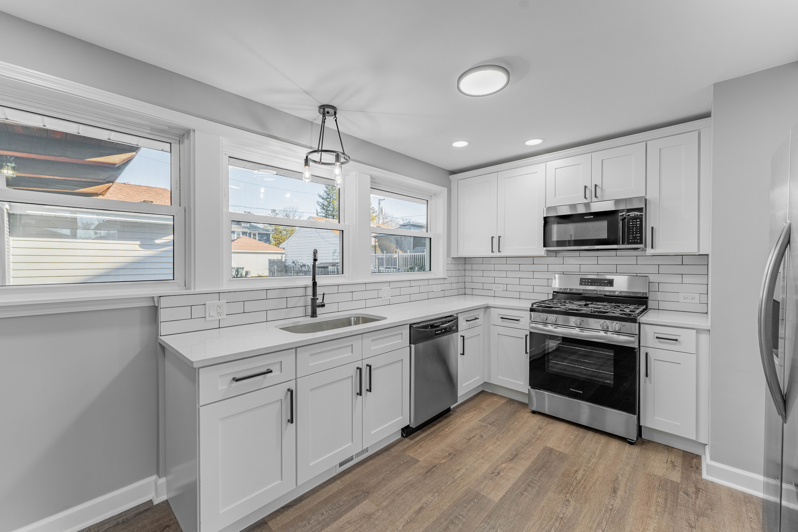 3615 Raymond Avenue Brookfield, IL 60513 - Photo 15 of 49 a kitchen with granite countertop a sink stainless steel appliances and window