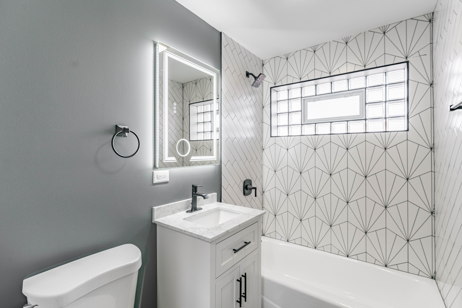 3615 Raymond Avenue Brookfield, IL 60513 - Photo 26 of 49 a bathroom with a sink a toilet and a shower curtain