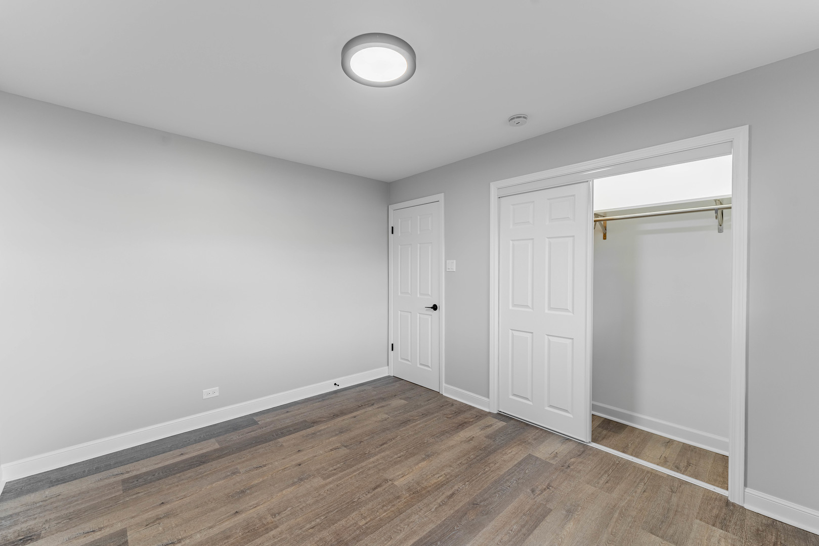 3615 Raymond Avenue Brookfield, IL 60513 - Photo 35 of 49 an empty room with wooden floor and window