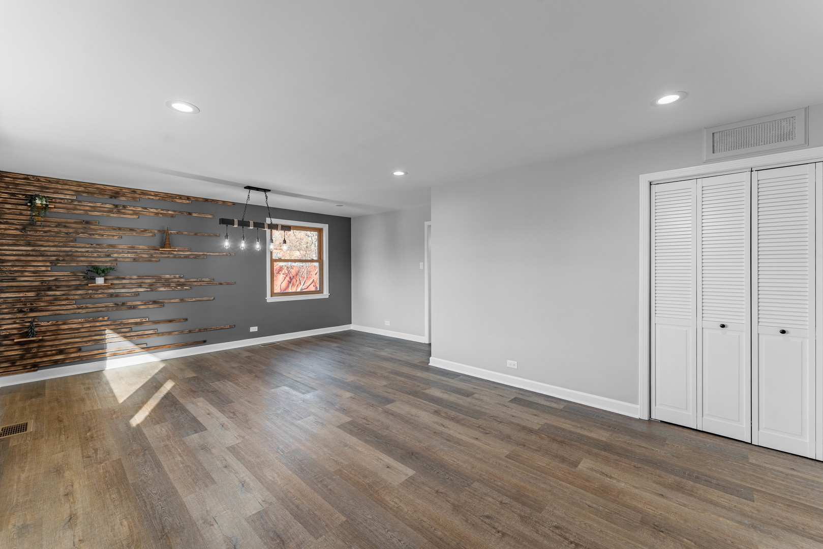 3615 Raymond Avenue Brookfield, IL 60513 - Photo 6 of 49 an empty room with wooden floor and windows