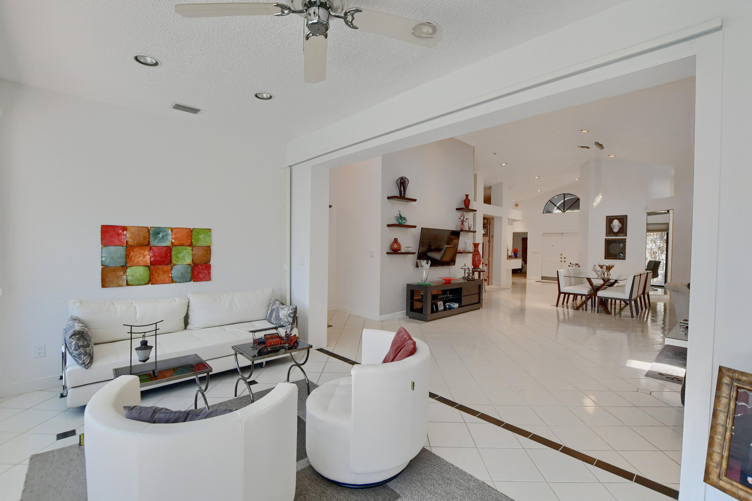 2108 Northwest 60th Circle Boca Raton, FL 33496 - Photo 19 of 29 a living room with furniture and a flat screen tv