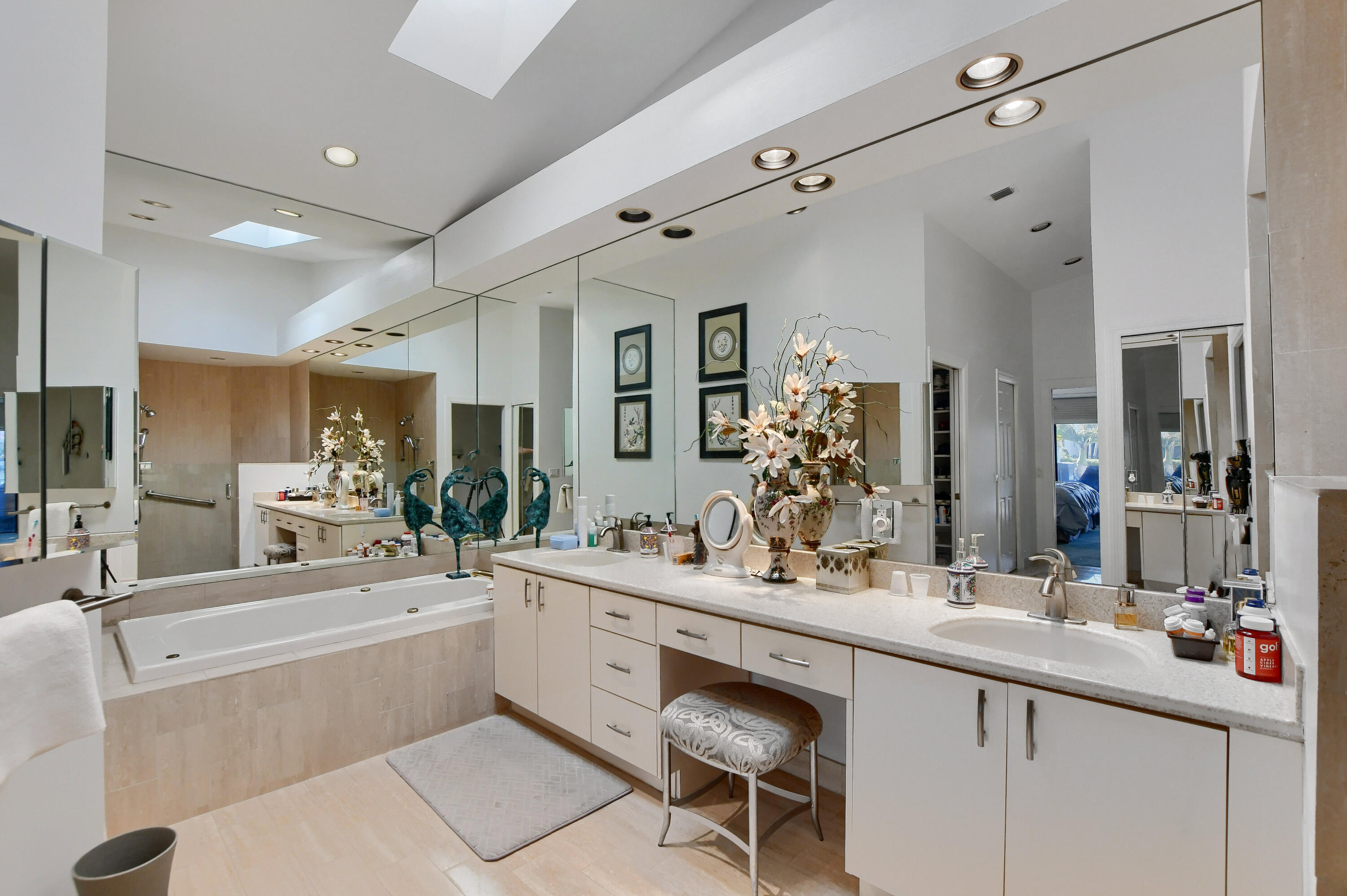 2108 Northwest 60th Circle Boca Raton, FL 33496 - Photo 25 of 29 a bathroom with a sink a large mirror and a shower