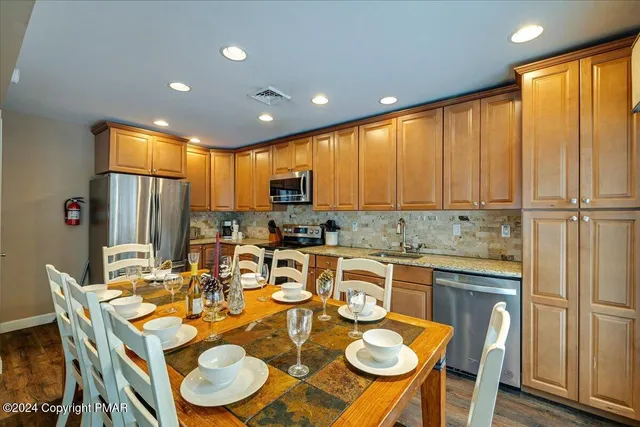 a view of a dining table and chairs