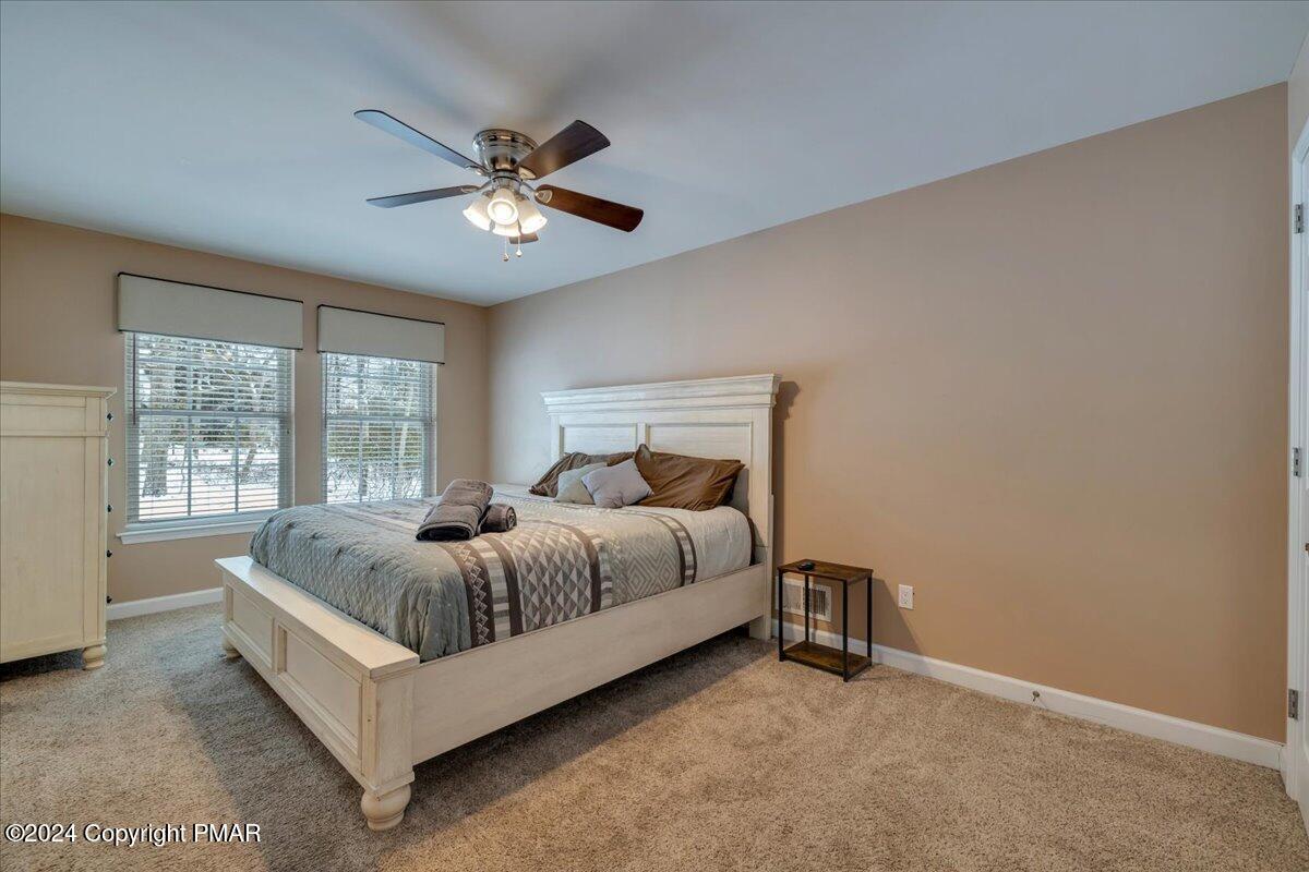 12 Beechwood Road Lake Harmony, PA 18624 - Photo 16 of 45 a bed sitting in a bedroom next to a window
