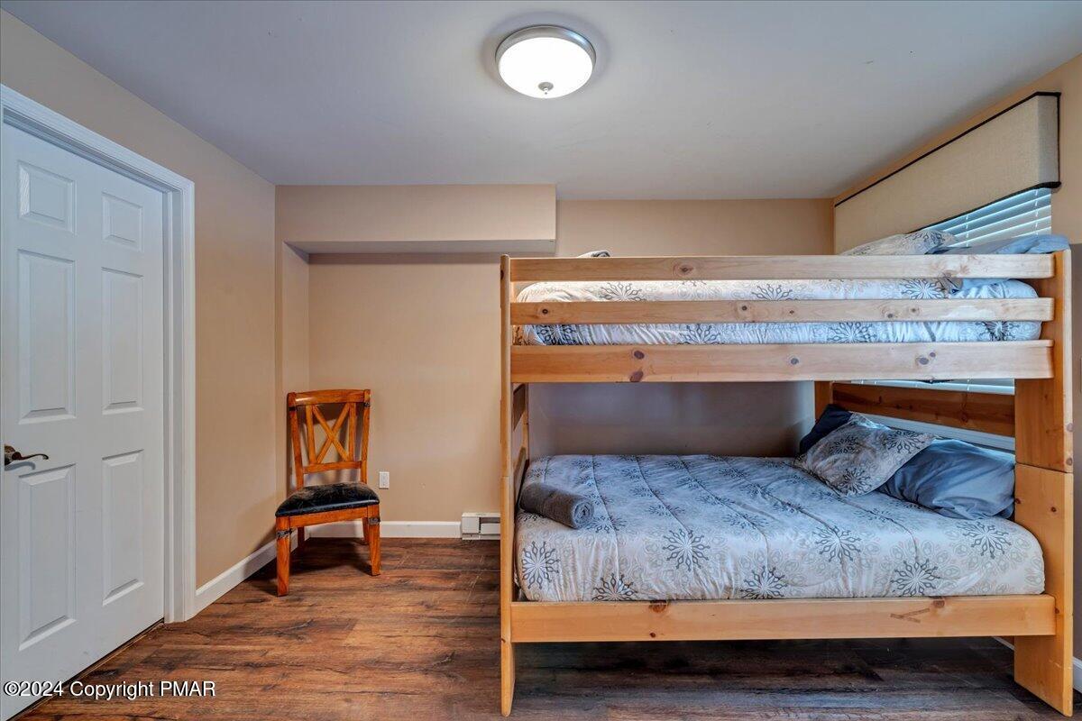 12 Beechwood Road Lake Harmony, PA 18624 - Photo 29 of 45 a bedroom with a bed and a table in it