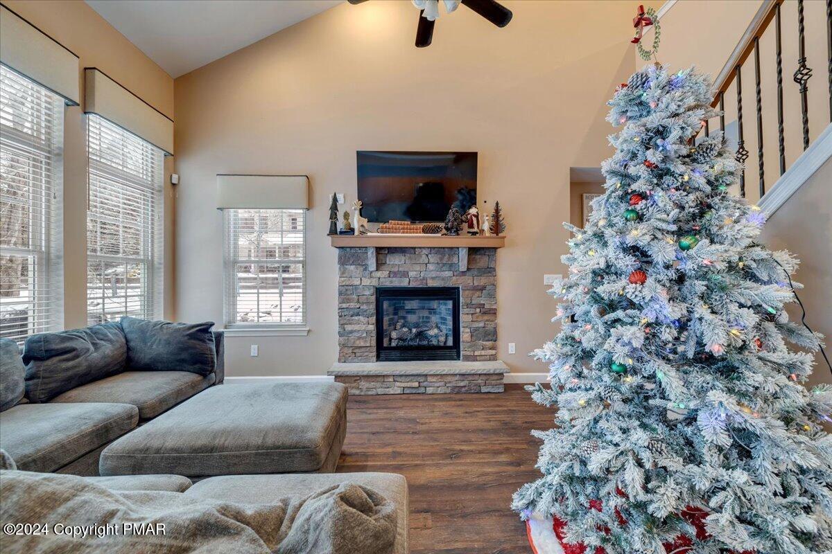 12 Beechwood Road Lake Harmony, PA 18624 - Photo 9 of 45 a living room with a fireplace and a flat screen tv