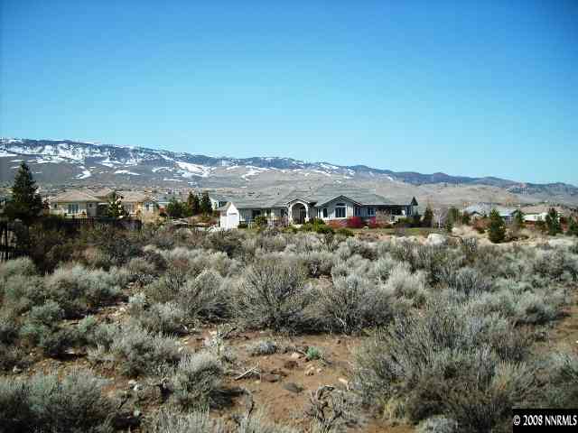 4940 Gila Bend Road Reno, NV 89511 - Photo 6 of 7 an aerial view of houses with a street and green space