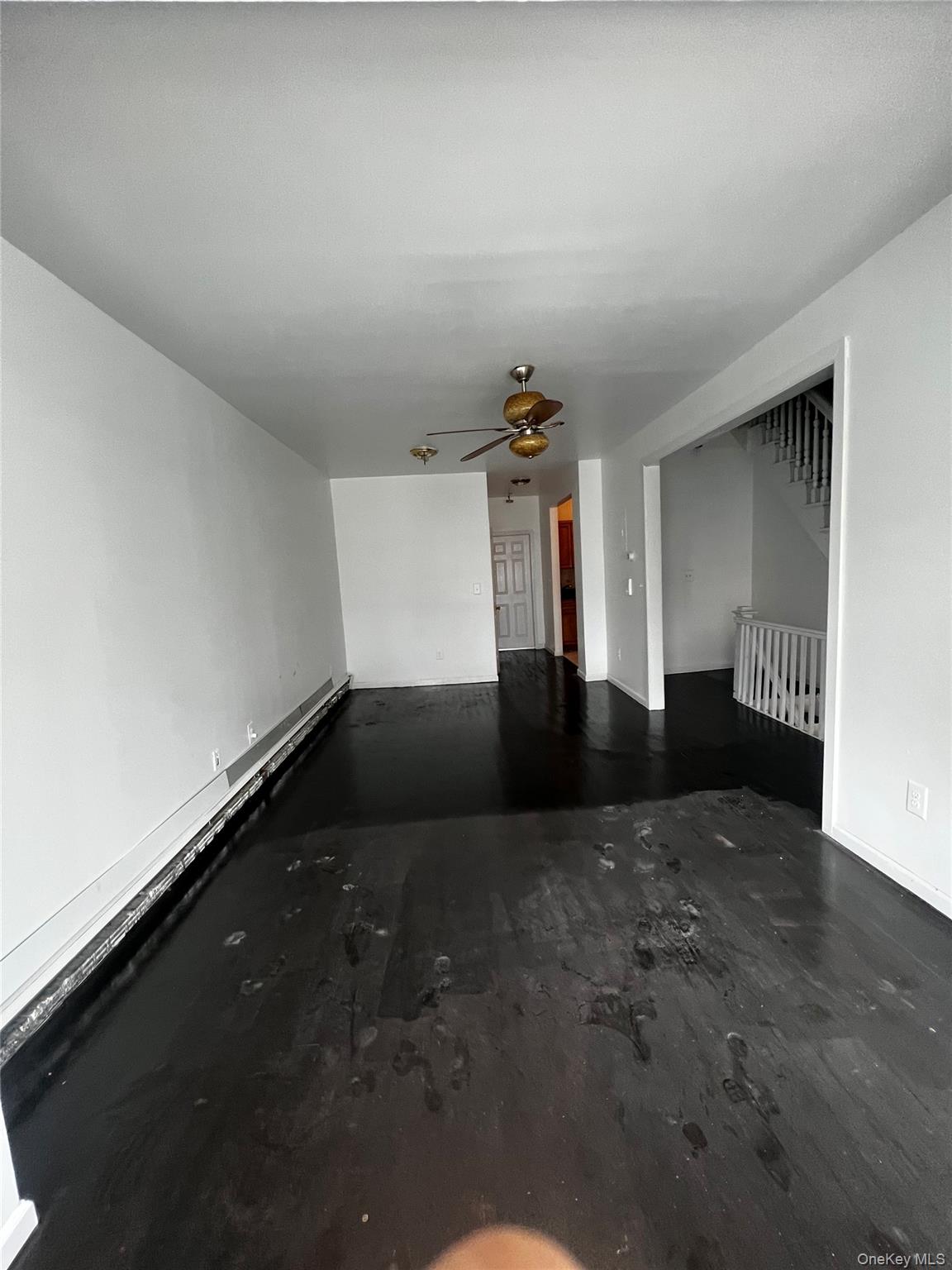 57-44 Granger Street Queens, NY 11368 - Photo 3 of 7 a view of an empty room and window