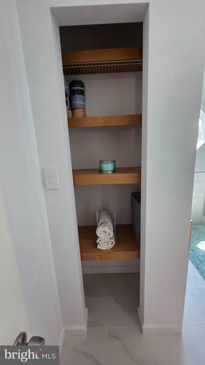 8418 Geneva Road Pasadena, MD 21122 - Photo 18 of 53 Sleek storage nook for essentials.