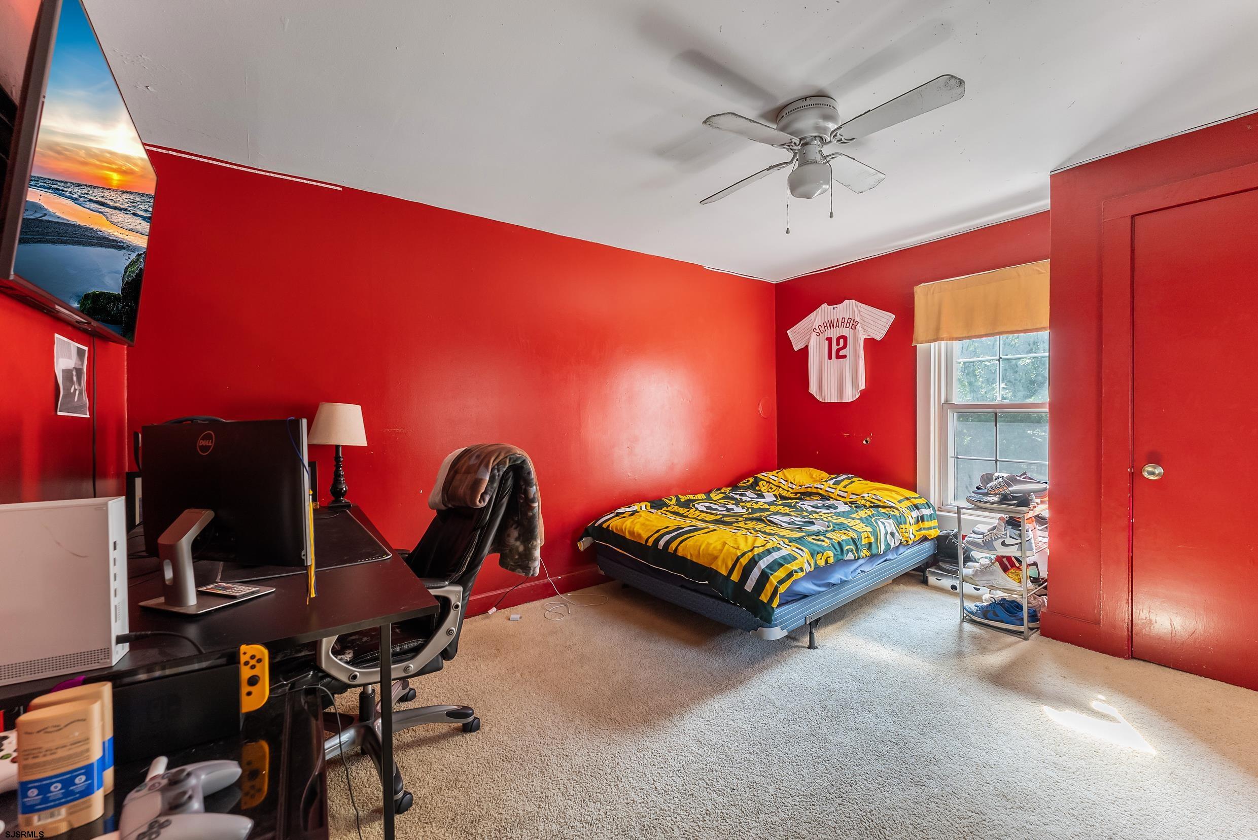 225 Chestnut Neck Road Port Republic, NJ 08241 - Photo 14 of 29 a bed room with a bed and a chair