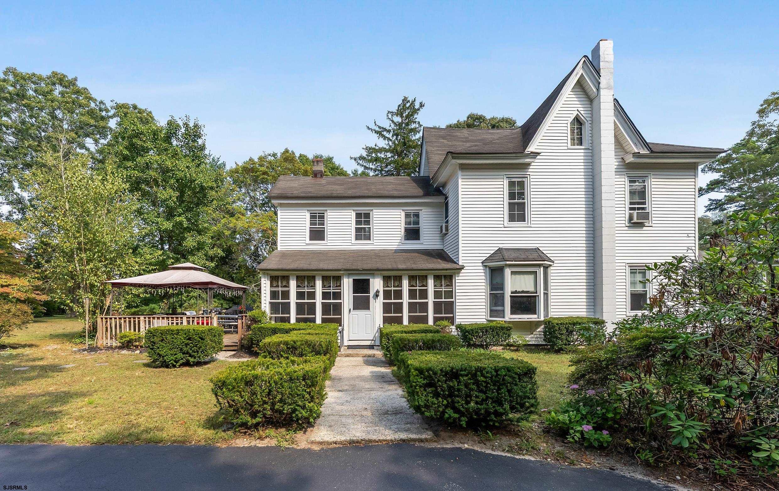 225 Chestnut Neck Road Port Republic, NJ 08241 - Photo 18 of 29 a front view of a house with a yard