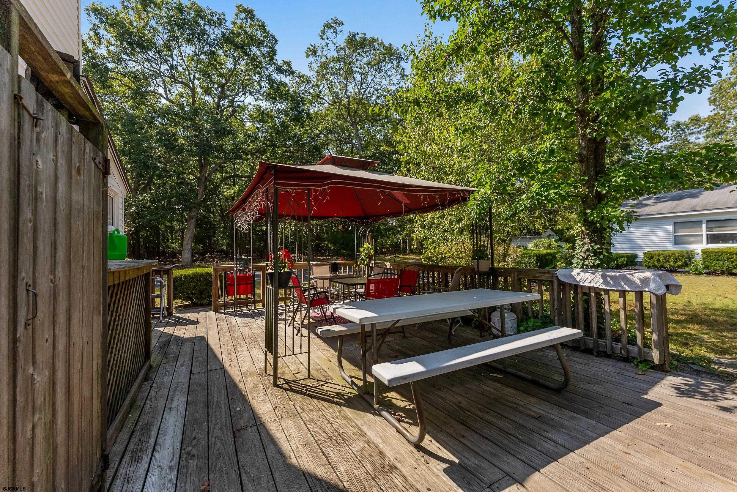 225 Chestnut Neck Road Port Republic, NJ 08241 - Photo 19 of 29 a view of a chairs and table in the balcony